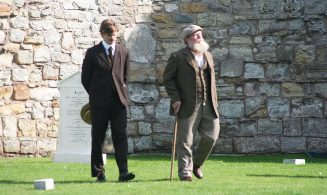 Peter Mullan (right) during filming in St Andrews this week.