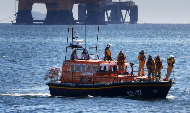 The coastguard launched a search off the coast of East Wemyss when a fishing boat overturned in the Firth of Forth.