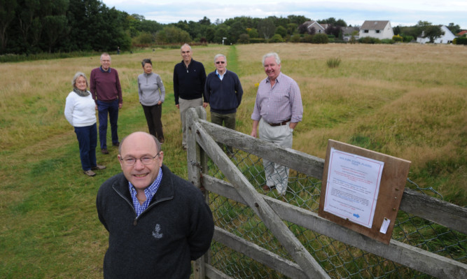 Some of the residents who are fighting plans for housing at former playing fields in St Andrews, from left: Morag Lorimer, Ian Lorimer, Sayoko Barbour, Derick James, David Barbour, David Anderson and, front, Kingsley Smith.
