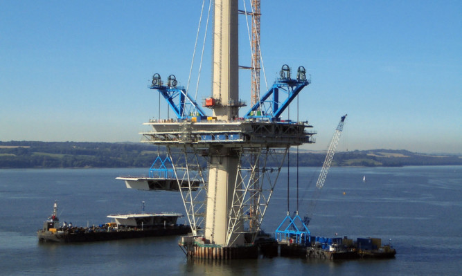 The 800-tonne deck unit is being lifted into place on the Queensferry Crossing's north tower, as work has begun to lift the deck into place and fill in the gaps between its three 200 metre high towers.