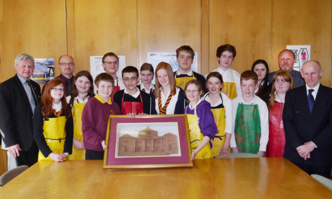 Montrose Academy staff and pupils with the clay sculpture of the front of their school. It took 18 months to produce.