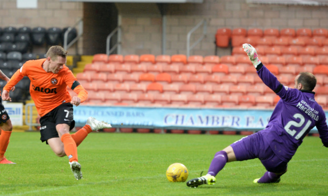 Billy Mckay (left) has his flick-shot saved by Jamie MacDonald.