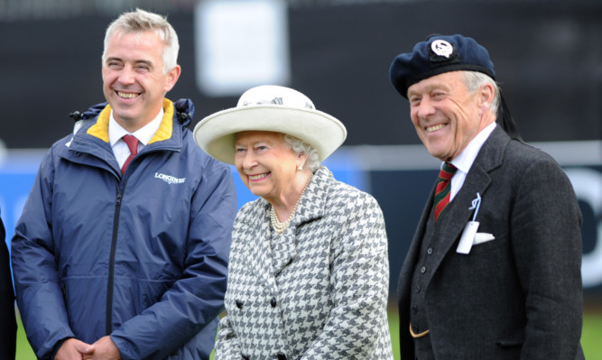 The Queen with event director Alec Lochore (leftr) and Lord Lieutenant Melville Jamieson.