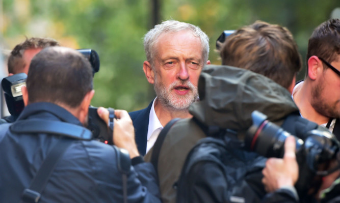 Labour party leader Jeremy Corbyn leaves Labour party HQ in London, as he insisted he has created a "unifying" and "inclusive" shadow cabinet.