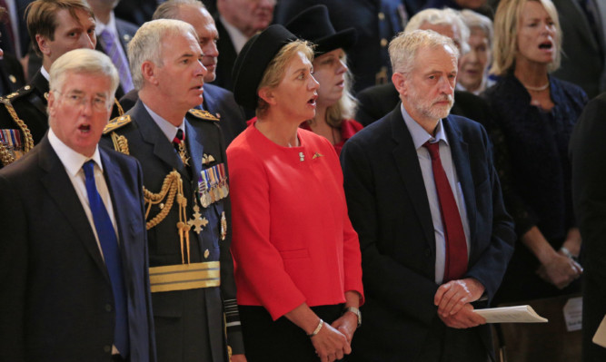 Avowed republican Jeremy Corbyn came in for criticism  and praise  for declining to sing the national anthem during a service at St Paul's Cathedral in London to mark the 75th anniversary of the Battle of Britain.