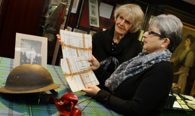 Helen Humphreys, left, who researched LCpl Beaton, and Kathleen Harris, whose grandads brother was LCpl Beaton, with a copy of his poem.