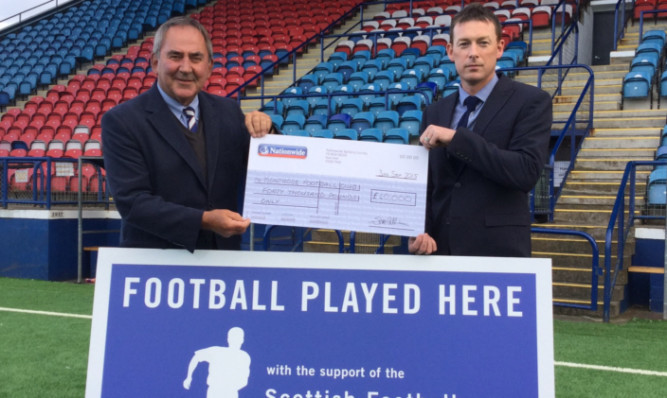 Montrose FC chairman Derek Sim, left, and Stuart McCaffrey, chief operating officer of the Scottish Football Partnership.