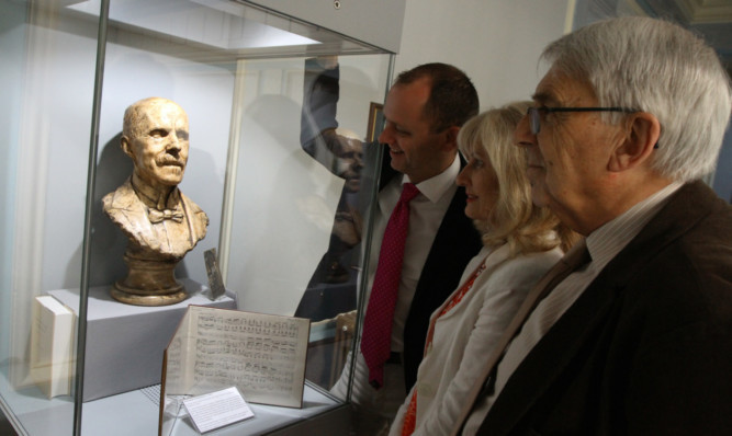 Admiring the bust of Alfred Hollins are, from left, city organist Stuart Muir, Caird Hall manager Susan Gillan and Jim McKellican, past chairman of Friends of the Caird Hall Organ.
