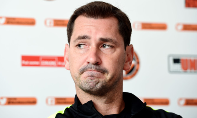 Jackie McNamara addresses the media.