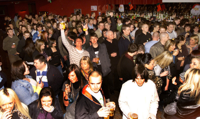 Fans enjoy the music at a Rocktalk Showcase in Yuppies bar in 2006.
