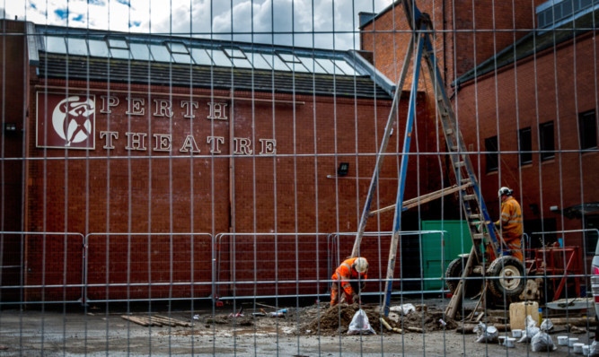 Workmen busy outside the theatre as renovation work proceeds apace.