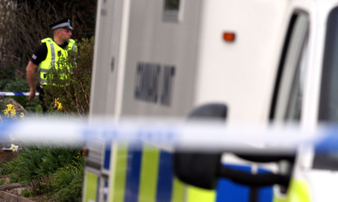 Police outside Mr Gardner's home in April.