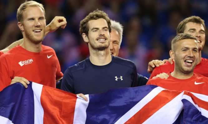 Andy Murray celebrates with his team-mates.