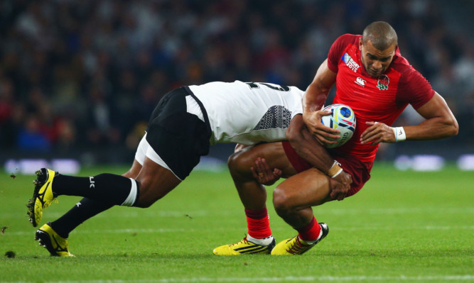 A tough tackle during the England v Fiji match at the Rugby World Cup.