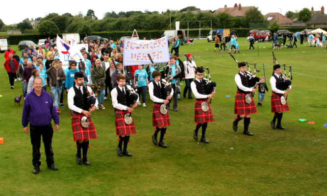 pipers from Arbroath RBLS Pipe Band led walkers on the last two laps.
