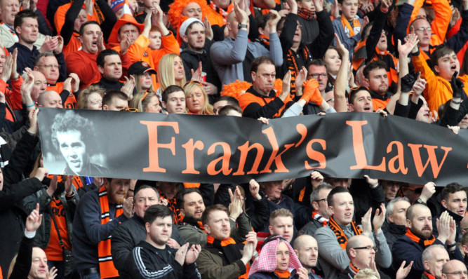 Dundee United fans joining in with the applause to back Frank's Law at Celtic Park.