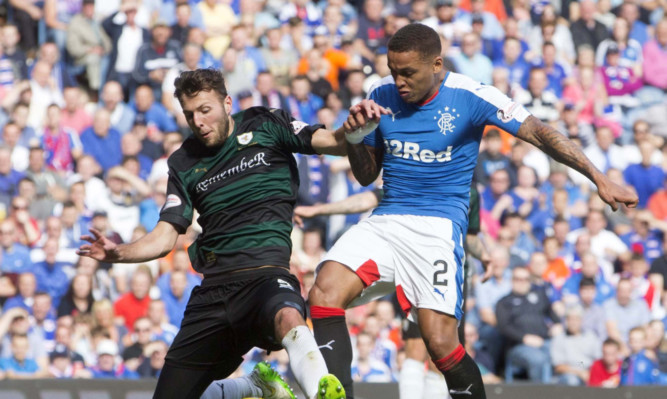 Lewis Toshney clashes with Rangers James Tavernier during the recent Ladbrokes Championship clash at Ibrox.