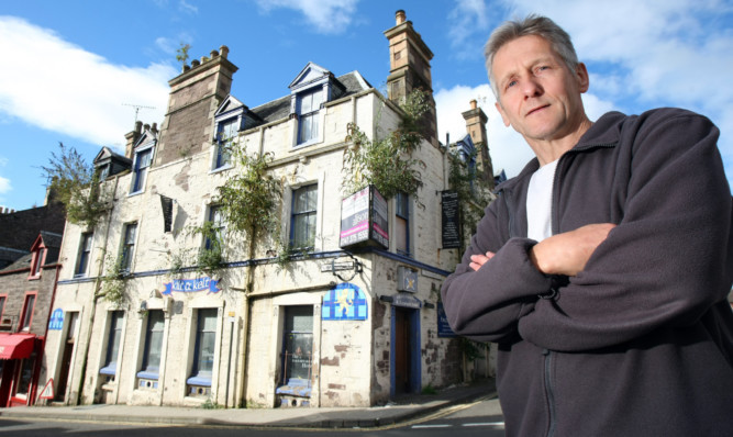 Mr Lamont fears someone could be injured by something falling from building.