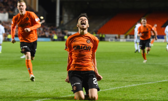 Scott Fraser celebrates scoring his first United goal.