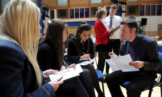 From left: Ellie Degernier, Kay Milton and India Malloch-Young of Morgan Academy in Dundee with The Couriers Dave Lord and, back, actors Ellen Bannerman and Euan Stamper who performed the scenarios that pupils discussed.