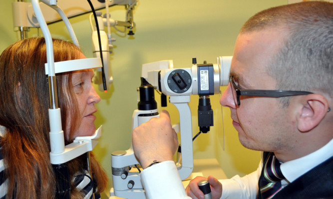 Lorna Hayes with ophthalmic director Kenny Johnston.