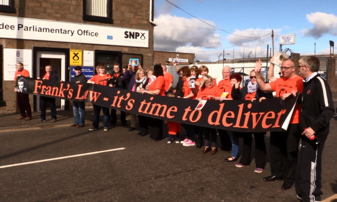 Campaigners stopped traffic outside the SNP office in Dundee.