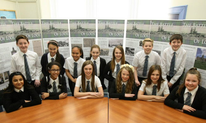 Some of the pupils, who have now moved up to Morgan Academy, with their panels on the Battle Of Loos.