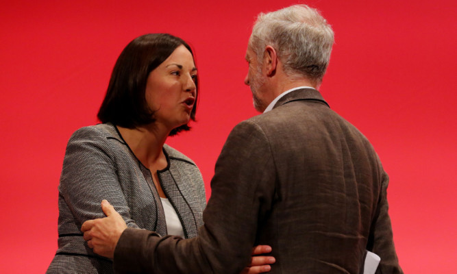 Scottish Labour leader Kezia Dugdale is congratulated by Jeremy Corbyn after delivering her speech to the conference in Brighton.