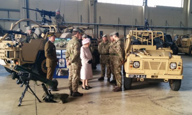 The Queen inspects some of the army's equipment transported from Germany.