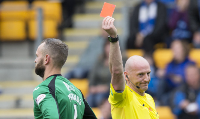 Alan Mannus is ordered off by Bobby Madden.