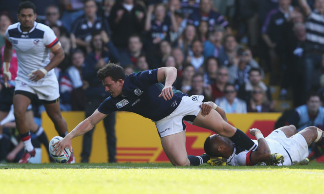 Matt Scott reaches out for the crucial fourth try against the USA.