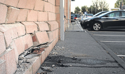 The damage caused to the wall of the Co-op.