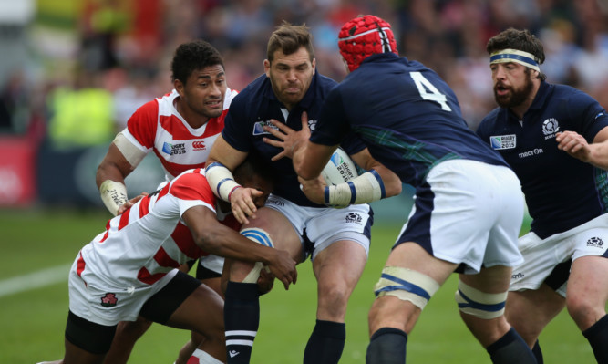 Sean Lamont takes a tackle winning his 98th cap against Japan last week.