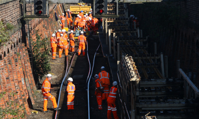 The site of the derailment has been a hive of activity.