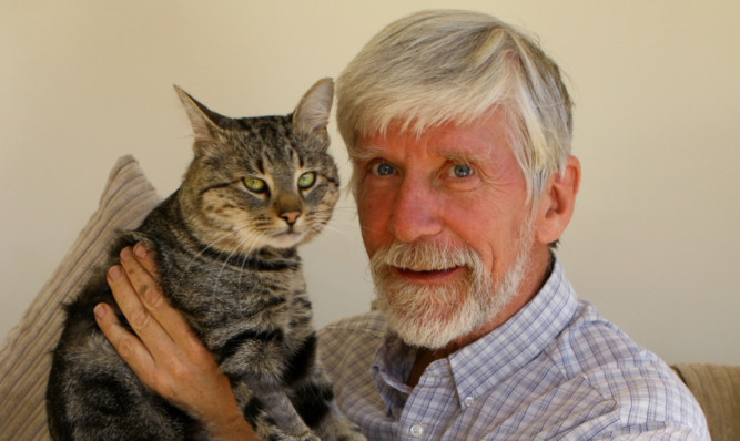 Mr Richards with well-loved Puss, who is on the mend.