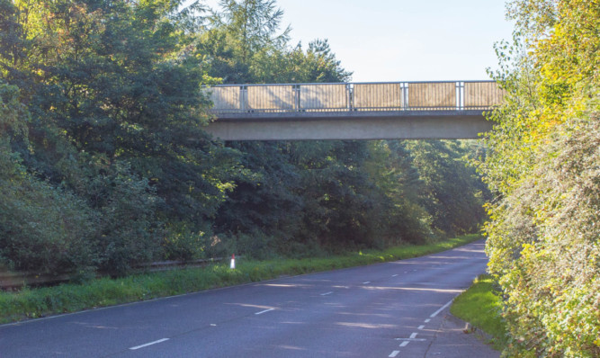 The footbridge over the B921 where the man fell.