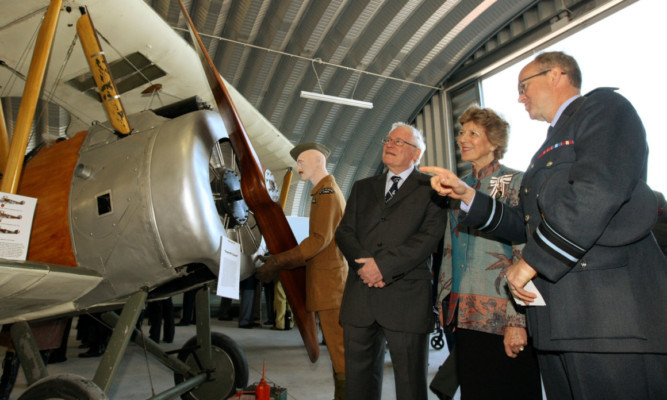 From left: Montrose Air Station Heritage Centre chairman Alan Doe, Lord Lt of Angus Georgiana Osborne and Air Vice-Marshal Ross Paterson beside a Sopwith Camel at the new exhibition.