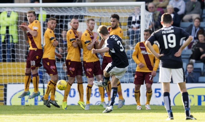 Kevin Holt curls in Dundee's winner.