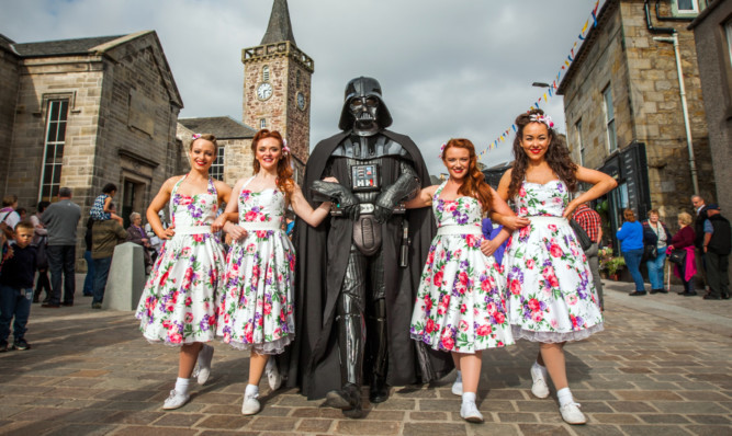 Dance troupe the Kennedy Cupcakes meets Darth Vader.