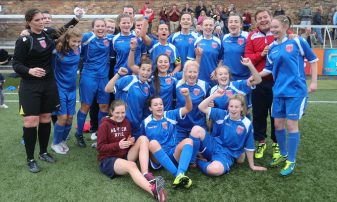 Keira Johnstone, centre, is congratulated after scoring Farmingtons fifth goal.