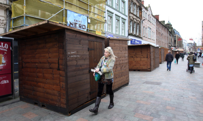 A row has erupted over the Christmas market last year after stalls were placed blocking store fronts and obstructing customers from shops in the city centre.