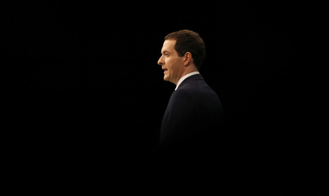 Chancellor George Osborne addresses the Conservative Party conference in Manchester.