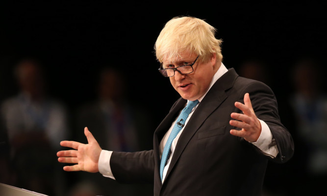 Boris Johnson addresses the Conservative Party Annual Conference at Manchester Central.