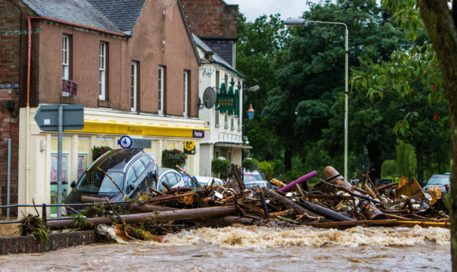 Debris piled up in Alyth Square during the flash flooding earlier this year.