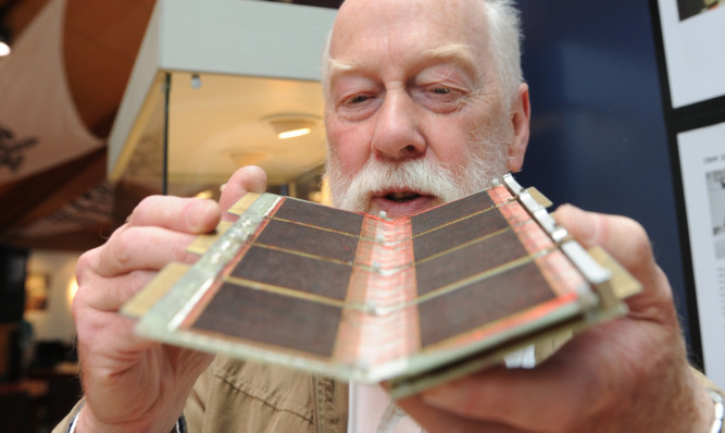 Retired St Andrews University Computing Officer from IT services Peter Adamson with one of the memory 'chips' from one of the early university computers