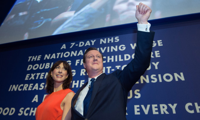 Prime Minister David Cameron poses with wife Samantha after his keynote speech on the final day of the Conservative Party Conference in Manchester.