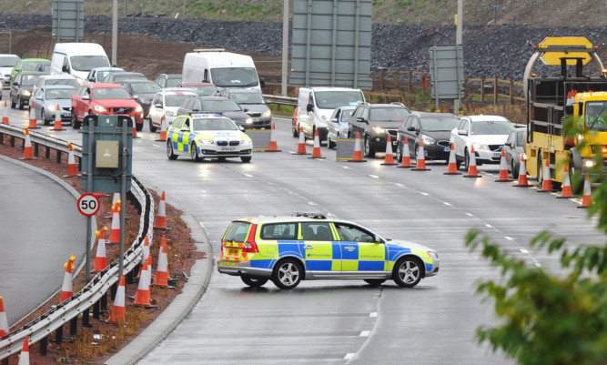 The approach to the Forth Road Bridge was closed off to all traffic and pedestrians as a precaution to allow a controlled explosion to take place near the bridge.