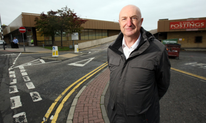 Neil Crooks outside The Postings shopping centre which may be at risk of closure.