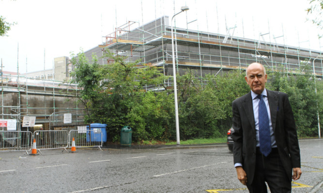 Councillor Willie Wilson outside Perth High School on Oakbank Road.