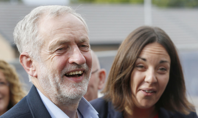 Labour leader Jeremy Corbyn and Scottish Labour leader Kezia Dugdale during a visit to Parkhead Housing association in Glasgow.